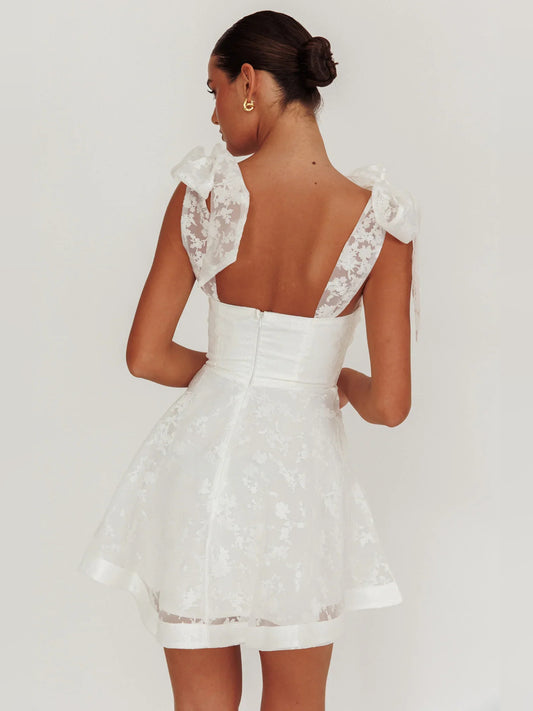 Ivory mini homecoming dress, back view showing the rear of the dress