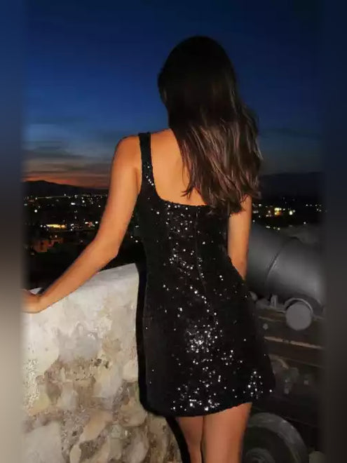 Black mini homecoming dress, back view showing the rear of the dress