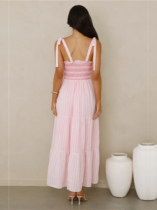 Pink a-line maxi formal dress with pleated skirt, full-length back view