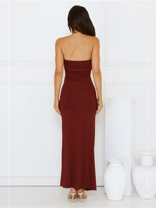 Burgundy sheath maxi formal dress with skirt slit, full-length back view