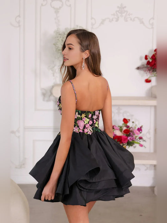 Black mini homecoming dress, back view showing the rear of the dress