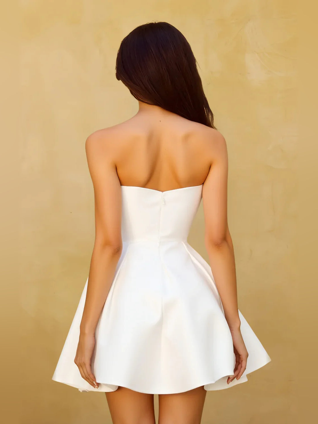 White mini homecoming dress, back view showing the rear of the dress