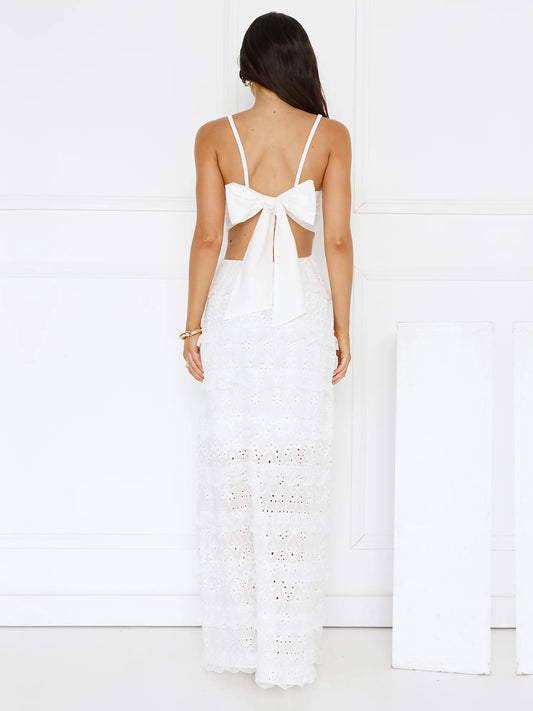 White a-line maxi formal dress with tiered skirt, full-length back view