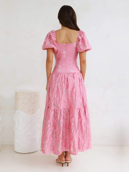 Pink a-line maxi formal dress with tiered skirt, full-length back view