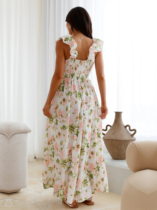 White a-line maxi formal dress with floral print, full-length back view