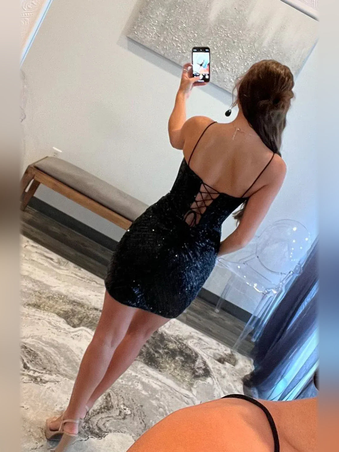 Black mini homecoming dress, alternate view showing the dress shape and hem