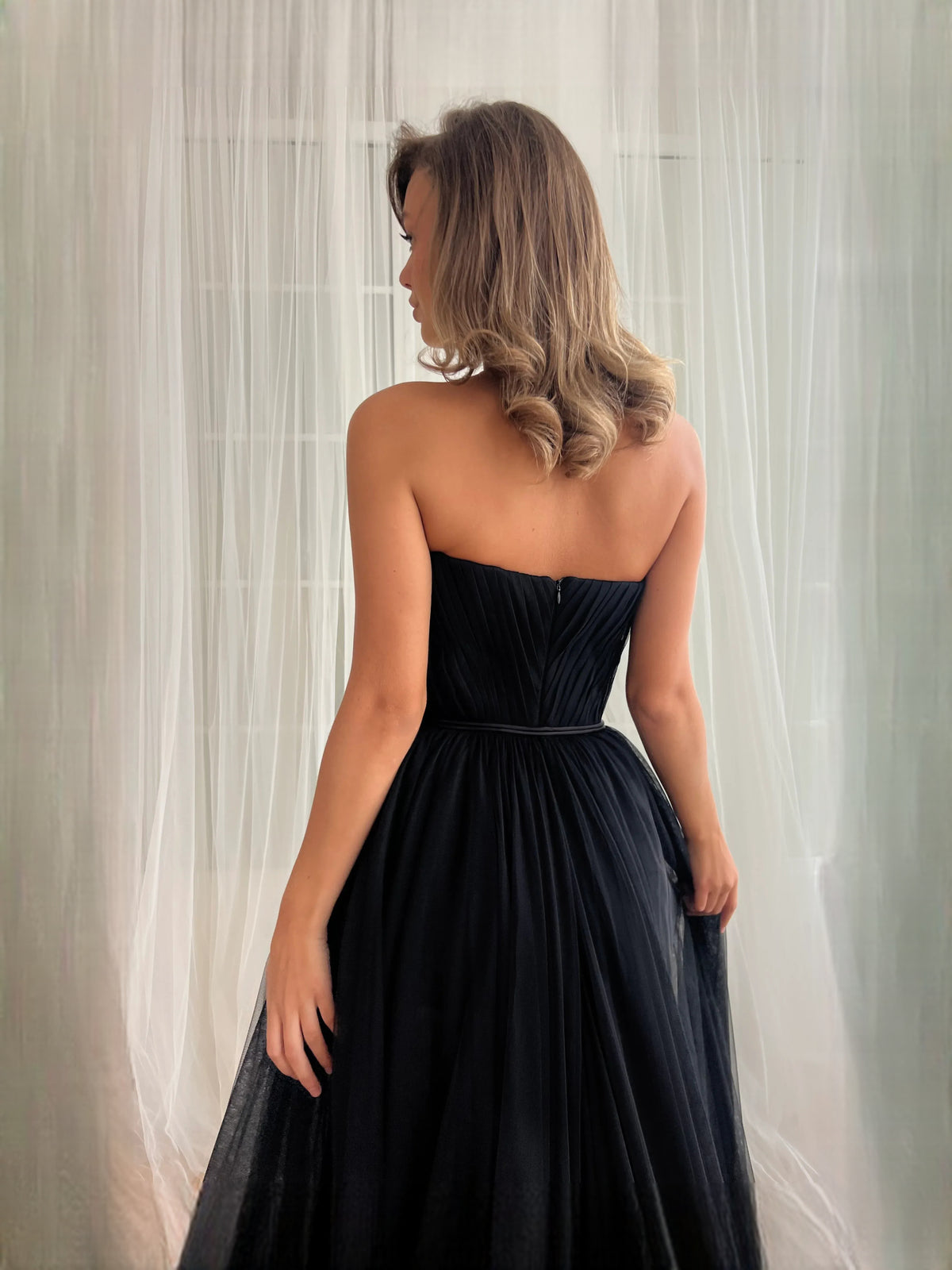 Black floor-length prom dress, alternate view showing the dress shape and hem