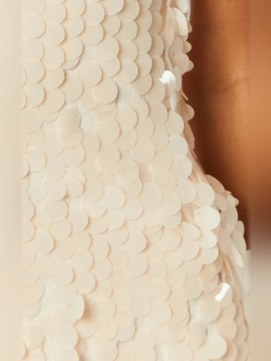Ivory white mini homecoming dress, alternate view showing the skirt and hem