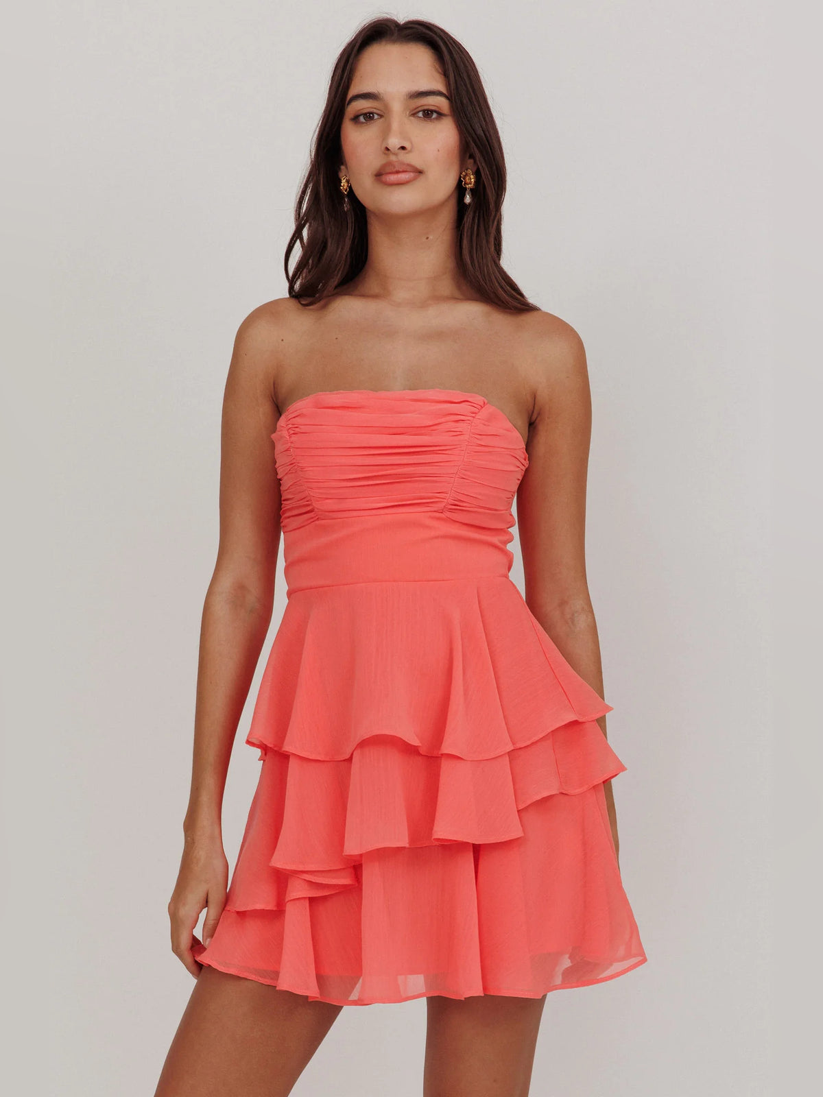 Peach mini homecoming dress, alternate view showing the skirt and hem