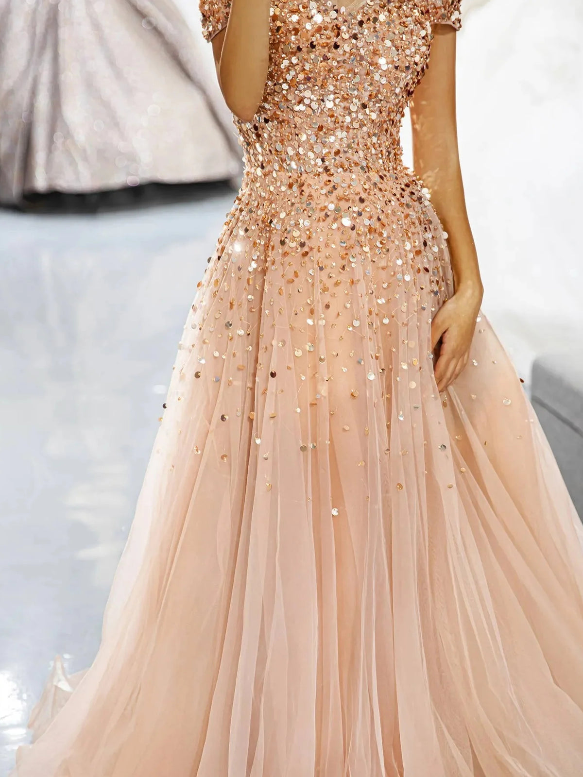 Champagne a-line floor-length formal dress with ruffle details, alternate view showing the shoulder line