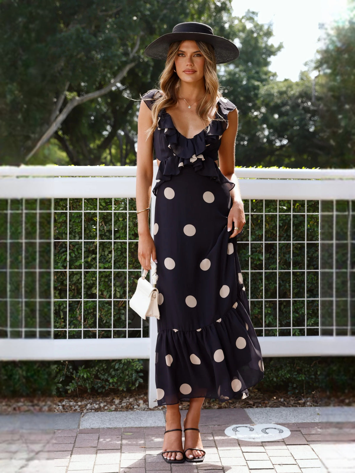 Black midi formal dress with printed pattern, alternate view showing the overall silhouette
