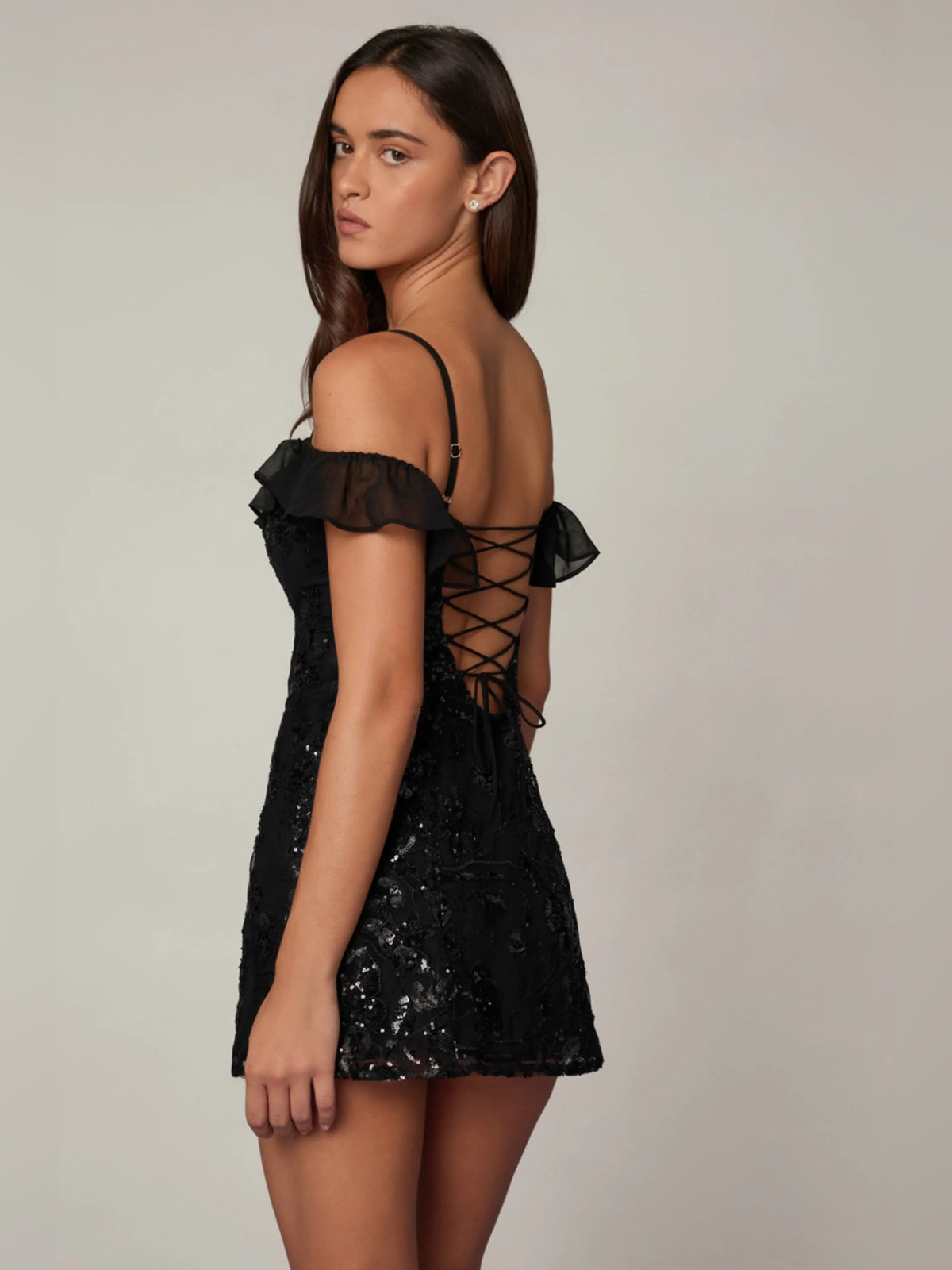 Black mini homecoming dress, alternate view showing the bodice and skirt from another angle