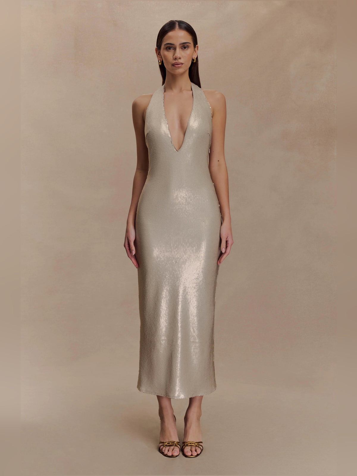 Gold midi formal dress with halter neckline, full-length front view