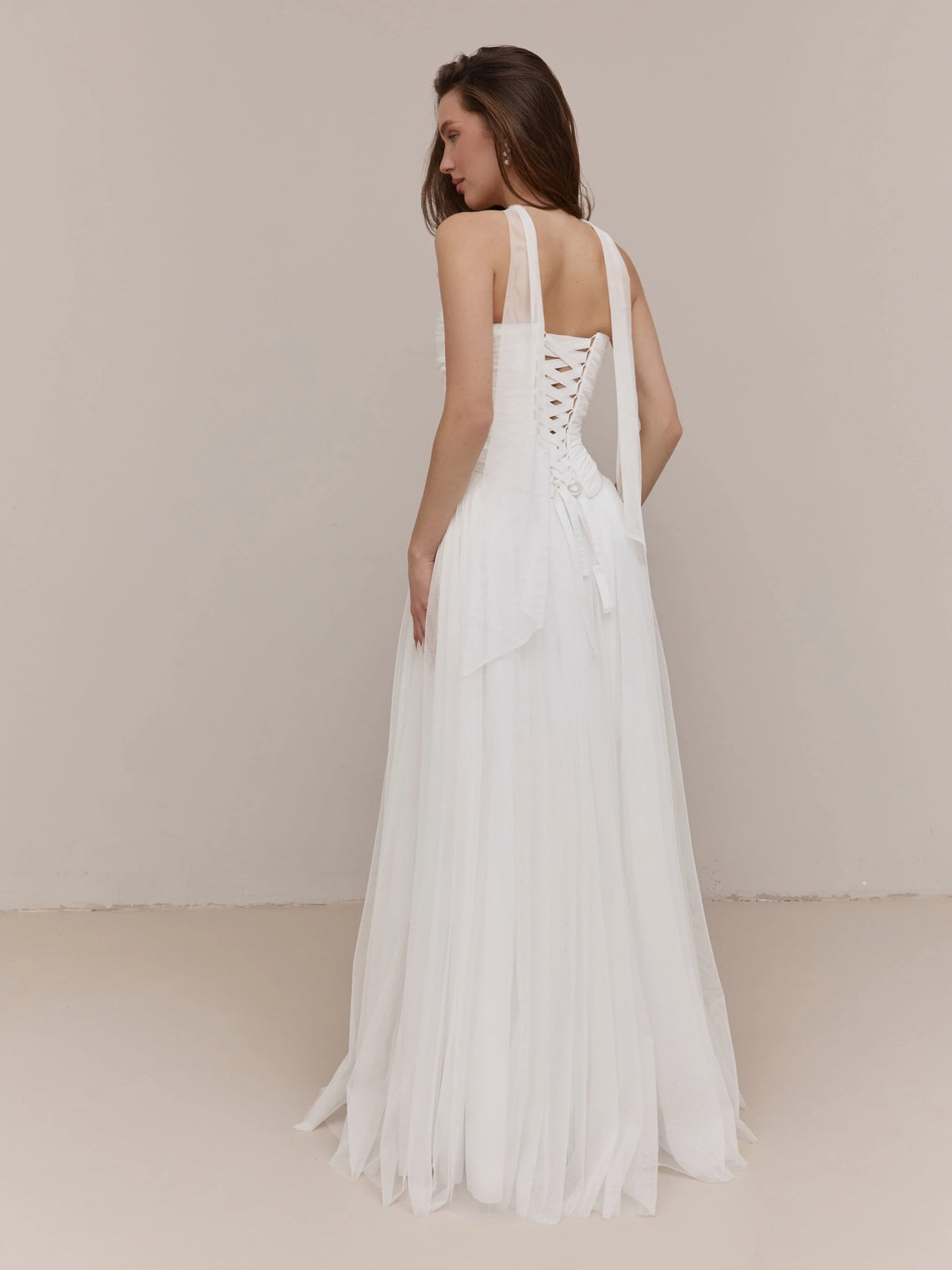 Ivory floor-length wedding dress, front view showing the a-line silhouette