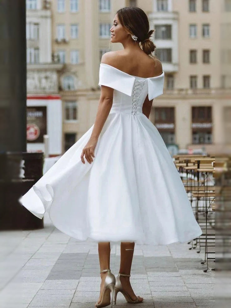 White short wedding dress, front view showing the a-line silhouette