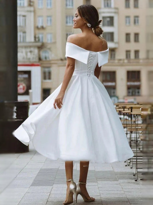White short wedding dress, front view showing the a-line silhouette
