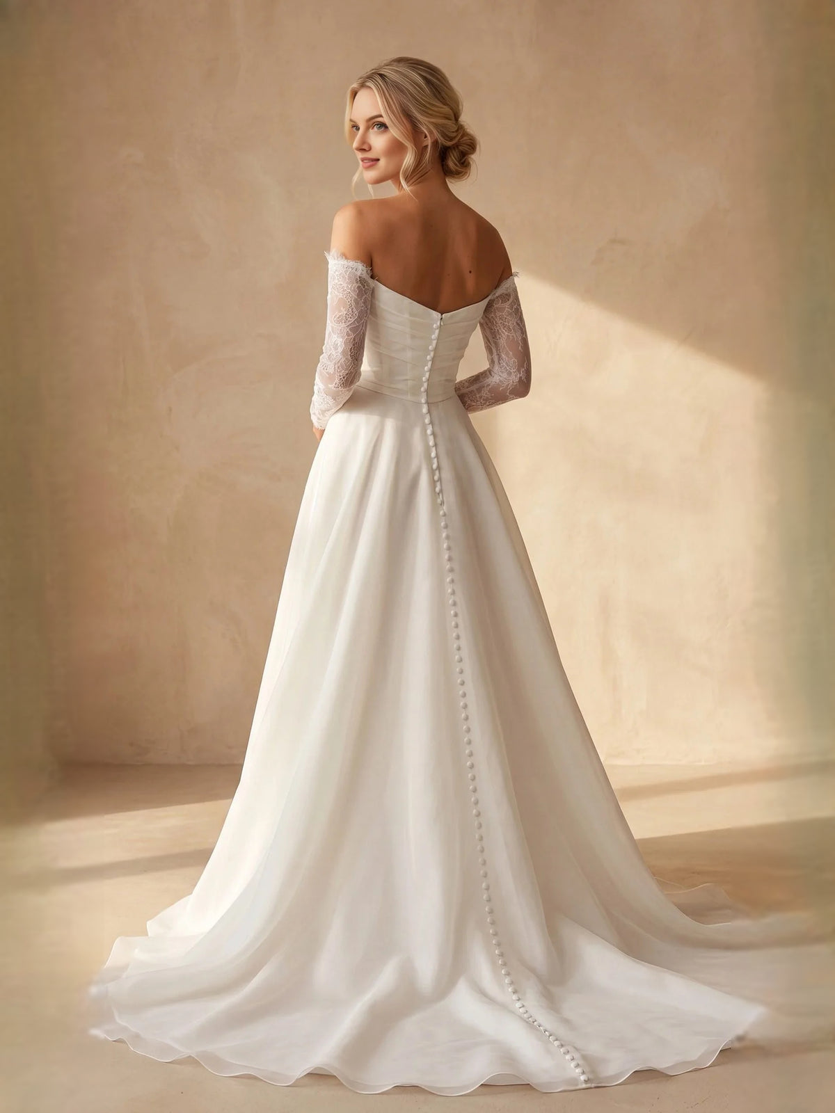 Ivory floor-length wedding dress, front view showing the a-line silhouette