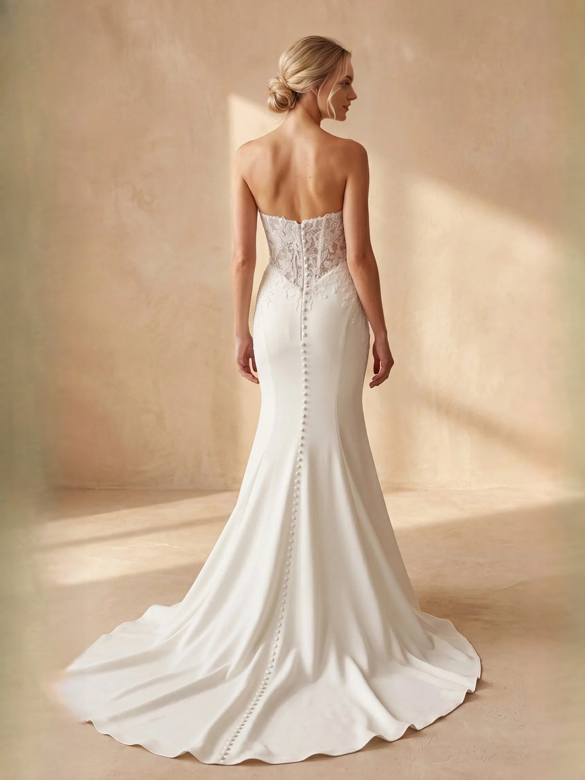 Ivory floor-length wedding dress, front view showing the mermaid silhouette