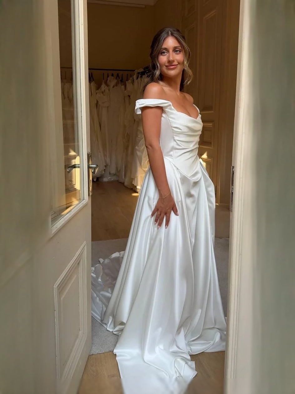 Ivory floor-length wedding dress, front view showing the a-line silhouette
