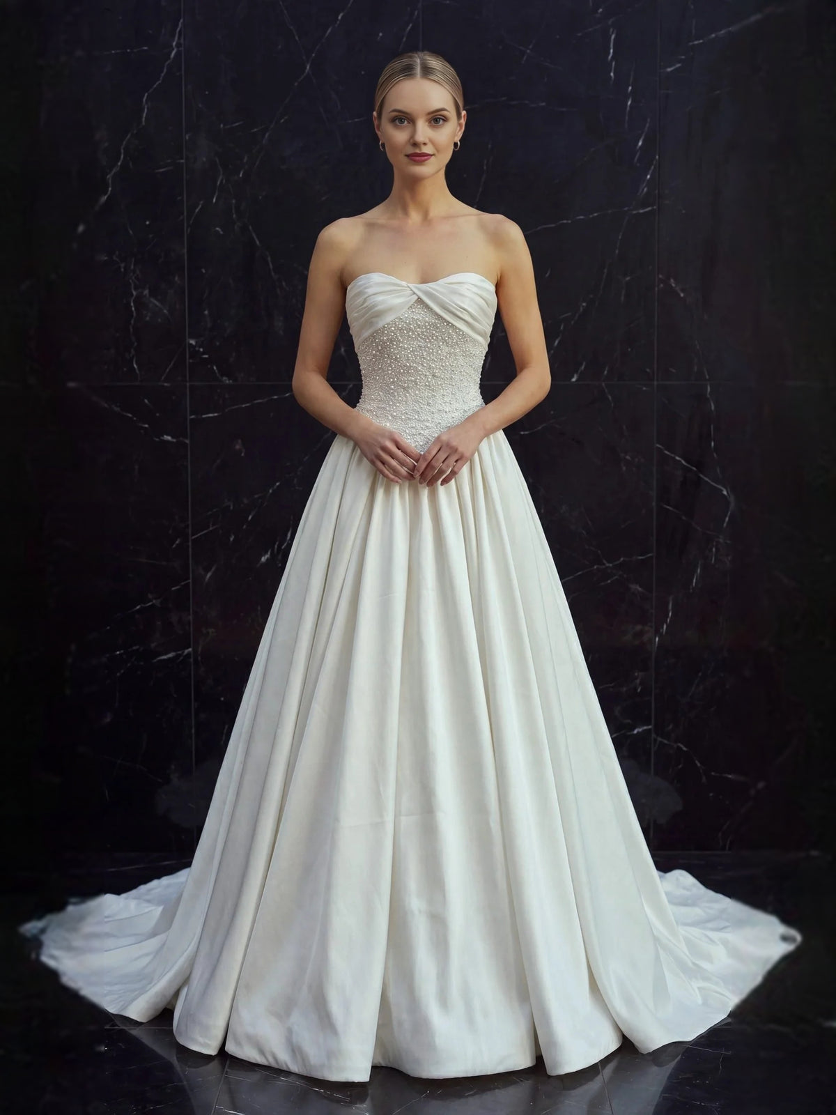 Ivory floor-length wedding dress, front view showing the a-line silhouette