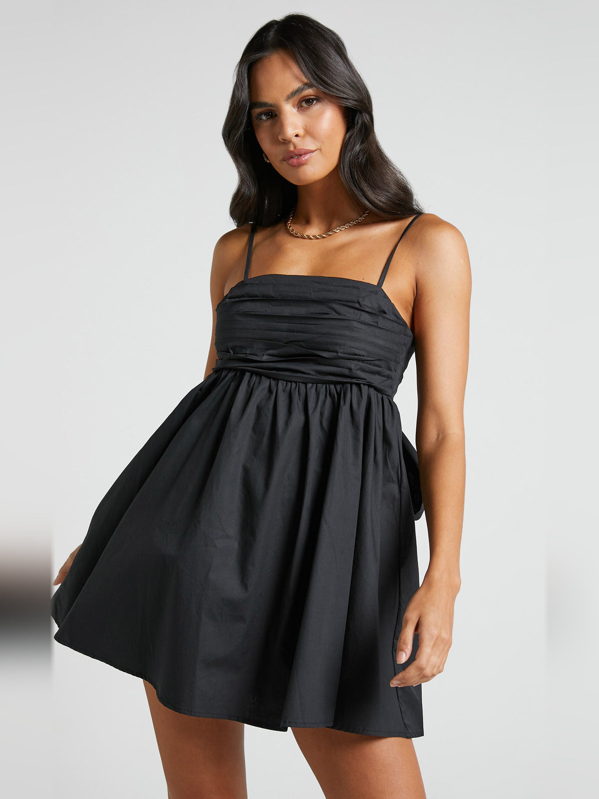 Black mini homecoming dress, front view showing the silhouette