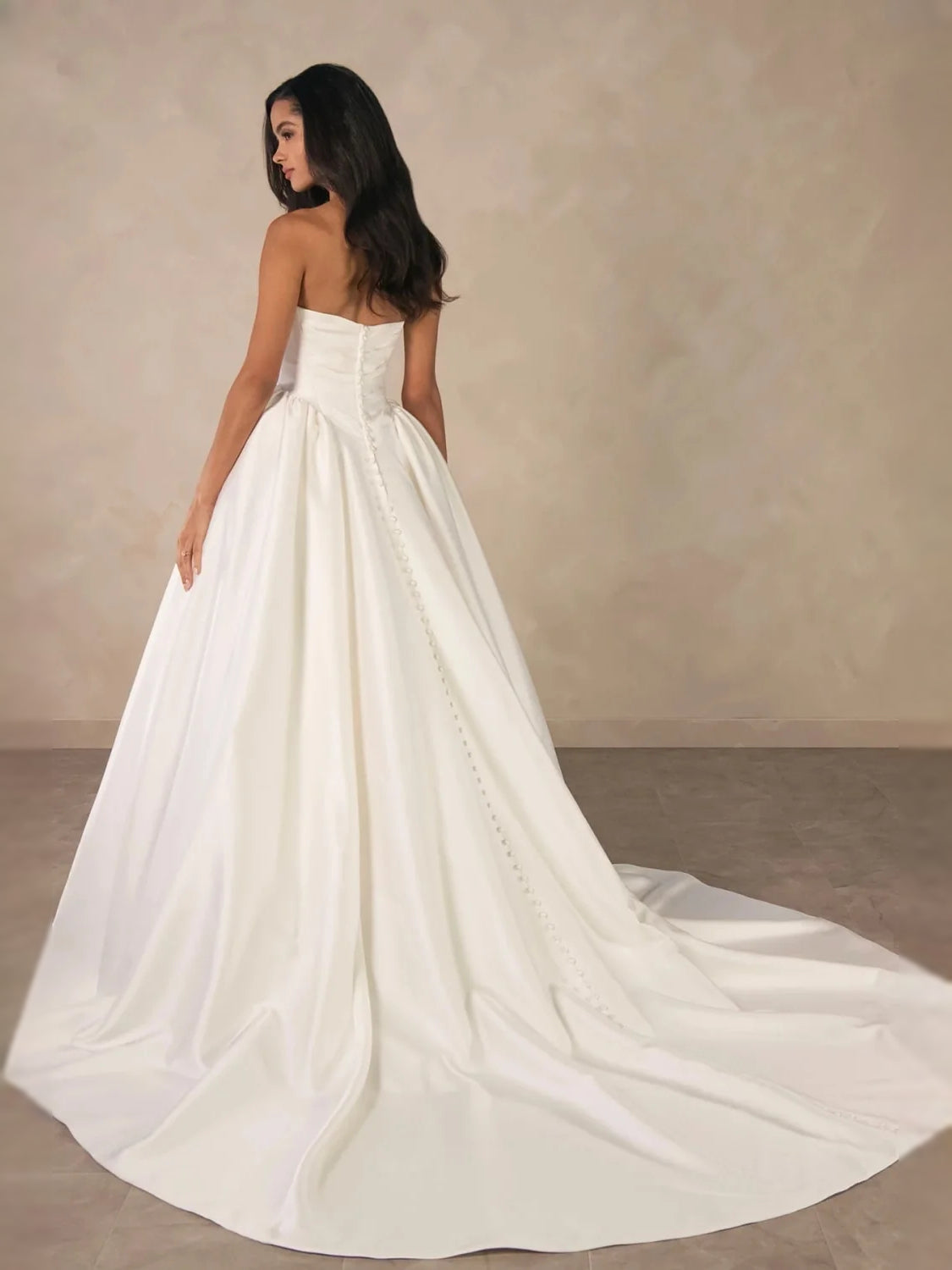 Ivory floor-length wedding dress, front view showing the a-line silhouette