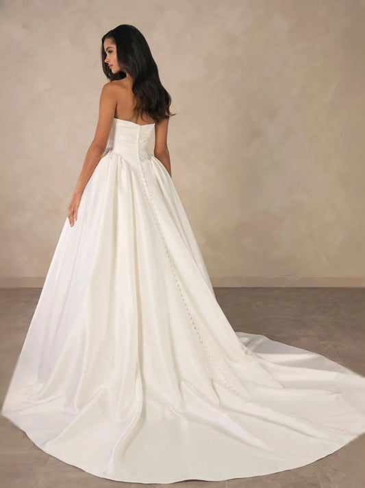 Ivory floor-length wedding dress, front view showing the a-line silhouette