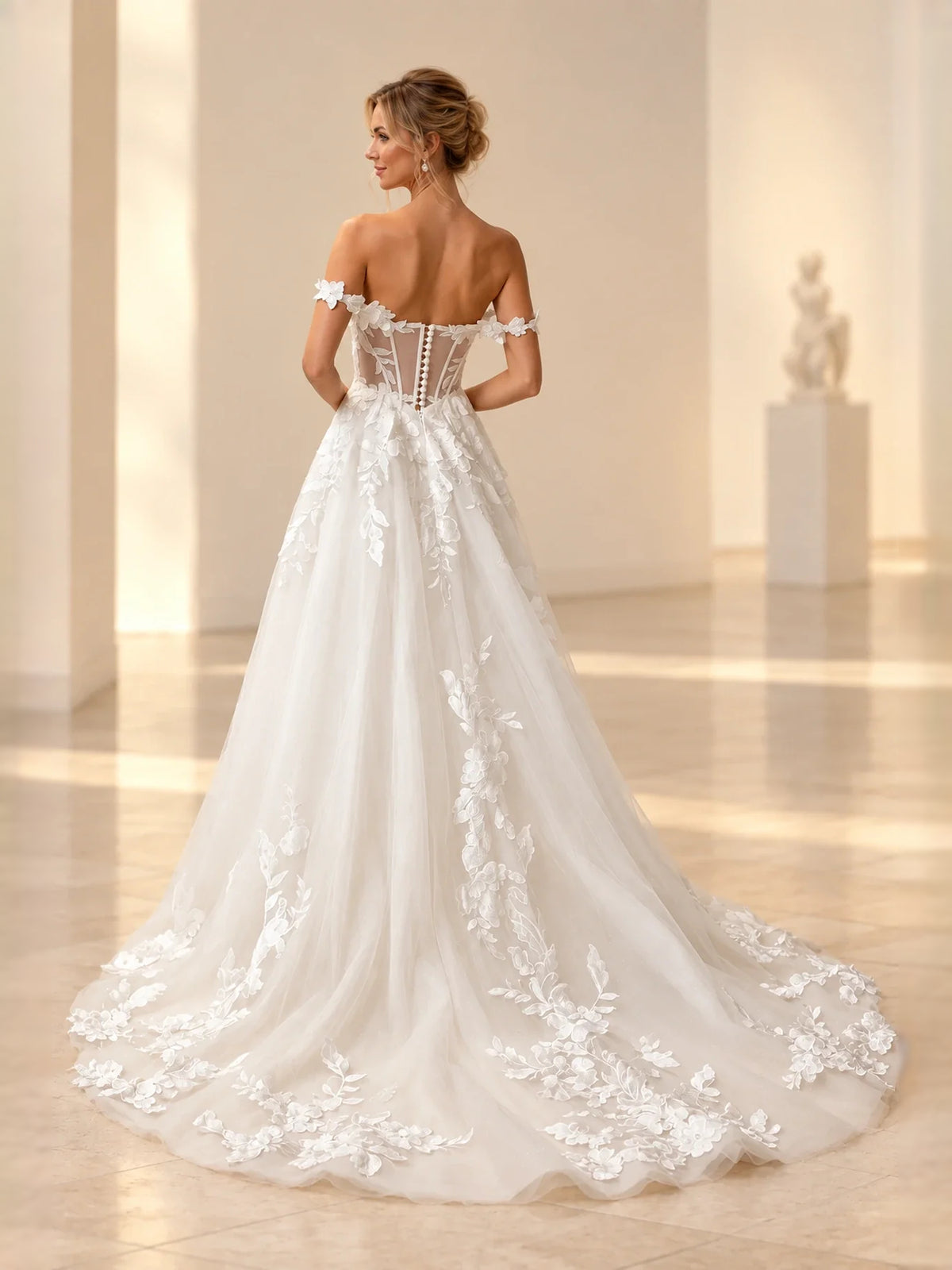 Ivory floor-length wedding dress, front view showing the a-line silhouette