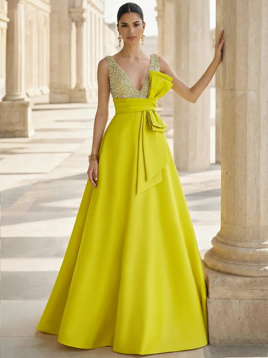 Yellow a-line floor-length formal dress with V-neckline, full-length front view