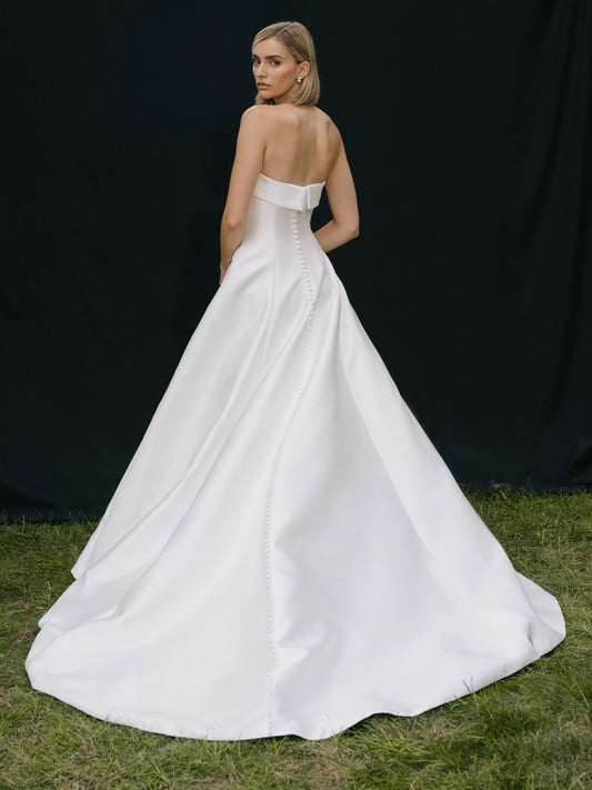 Ivory floor-length wedding dress, front view showing the a-line silhouette