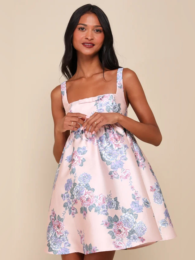 Pink Floral mini homecoming dress, front view showing the empire-waist silhouette