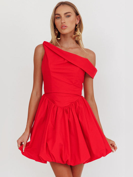 Red mini homecoming dress, front view showing the asymmetrical silhouette
