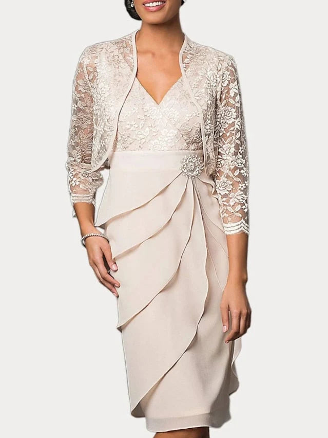 Cream knee-length mother of the bride dress, front view showing the fit-and-flare silhouette