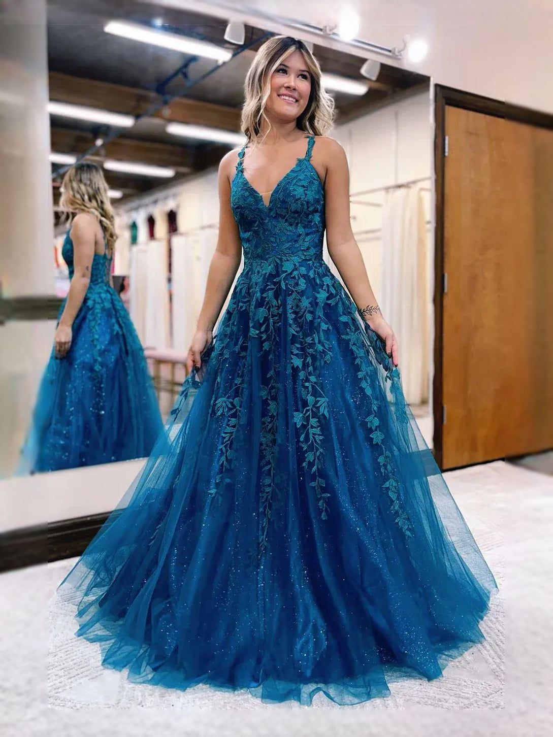 Teal floor-length prom dress, front view showing the ball-gown silhouette