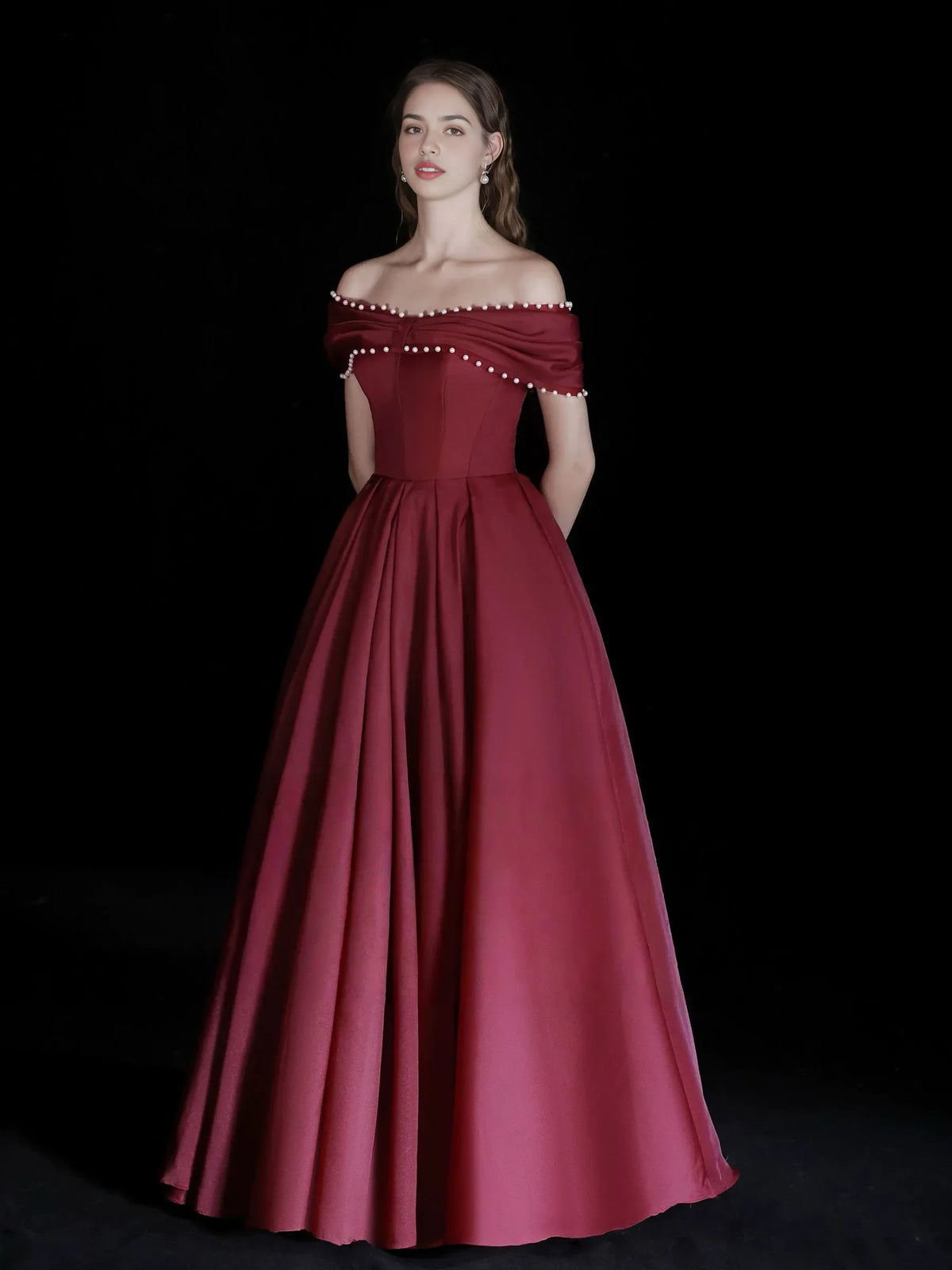 Burgundy a-line floor-length formal dress with off-the-shoulder neckline, full-length front view