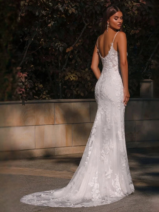 White floor-length wedding dress, front view showing the mermaid silhouette