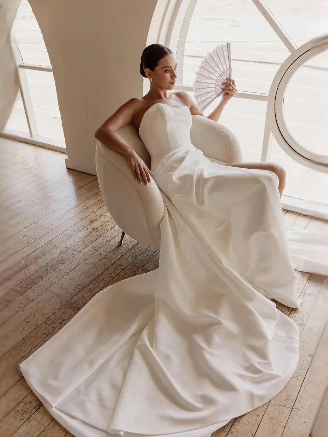 Ivory floor-length wedding dress, front view showing the ball-gown silhouette