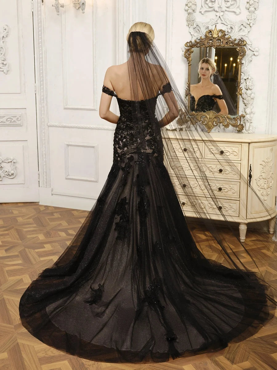 Black floor-length wedding dress, front view showing the mermaid silhouette