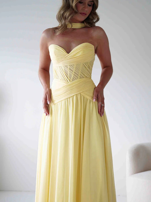 Yellow floor-length prom dress, front view showing the a-line silhouette