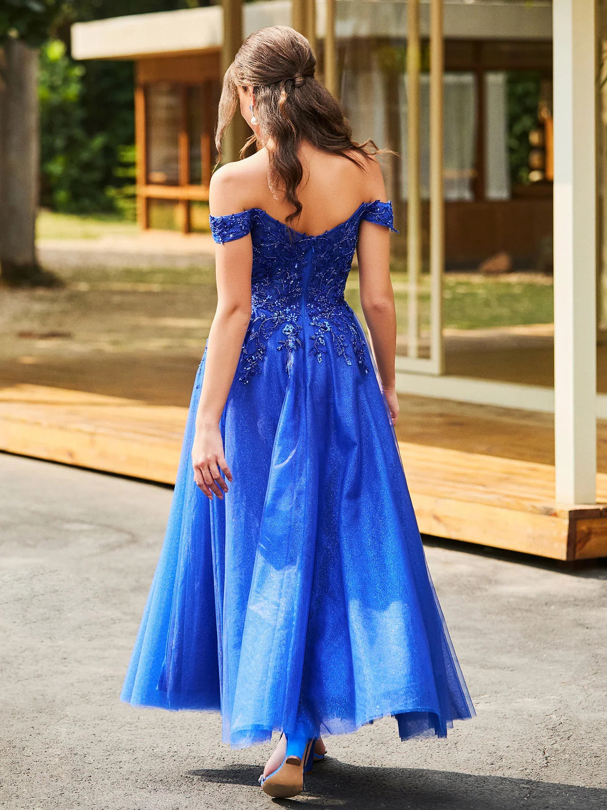 Blue tea-length prom dress, front view showing the a-line silhouette