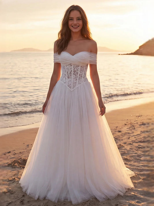 Ivory floor-length wedding dress, front view showing the a-line silhouette