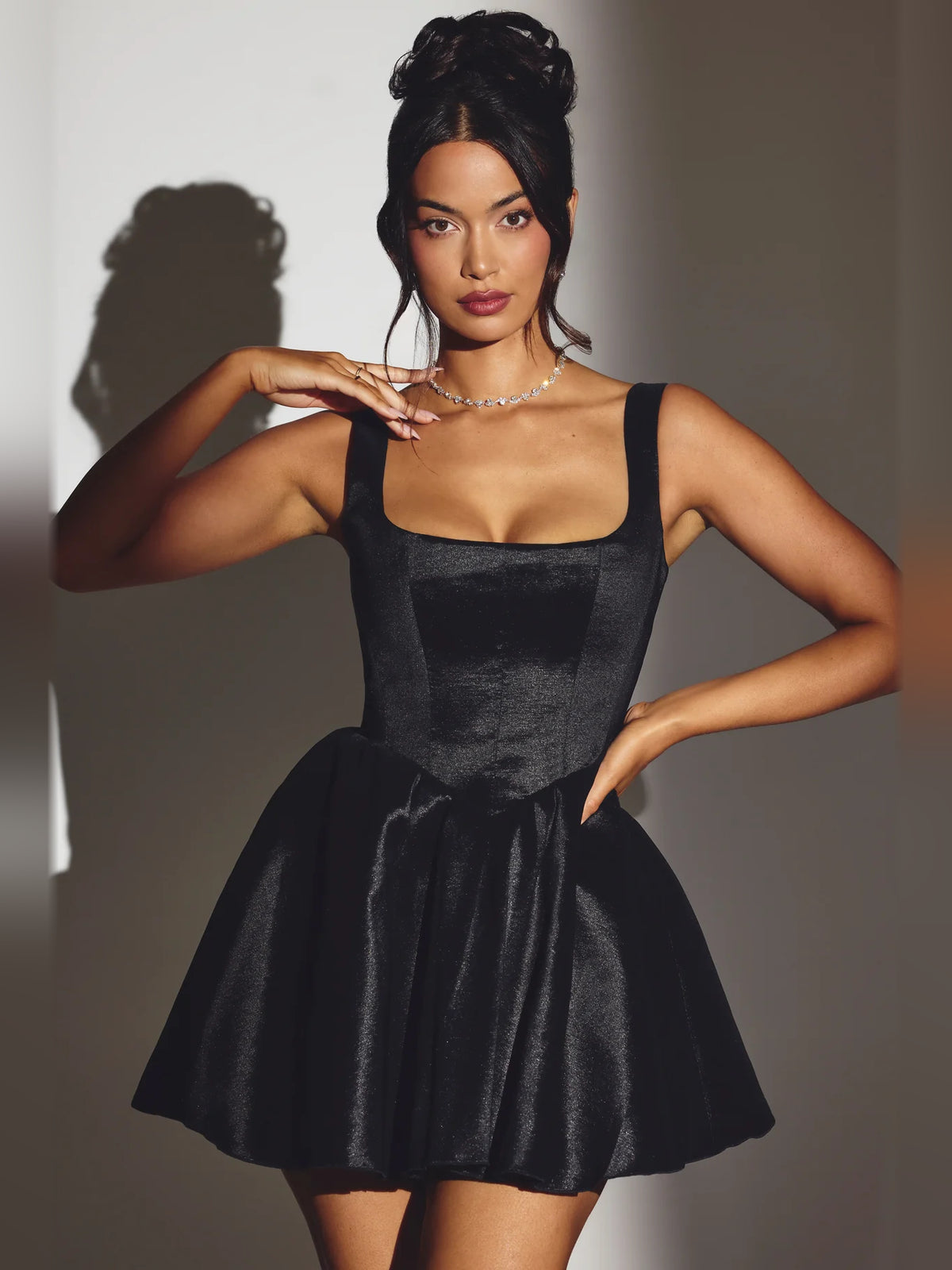 Black mini homecoming dress, front view showing the silhouette