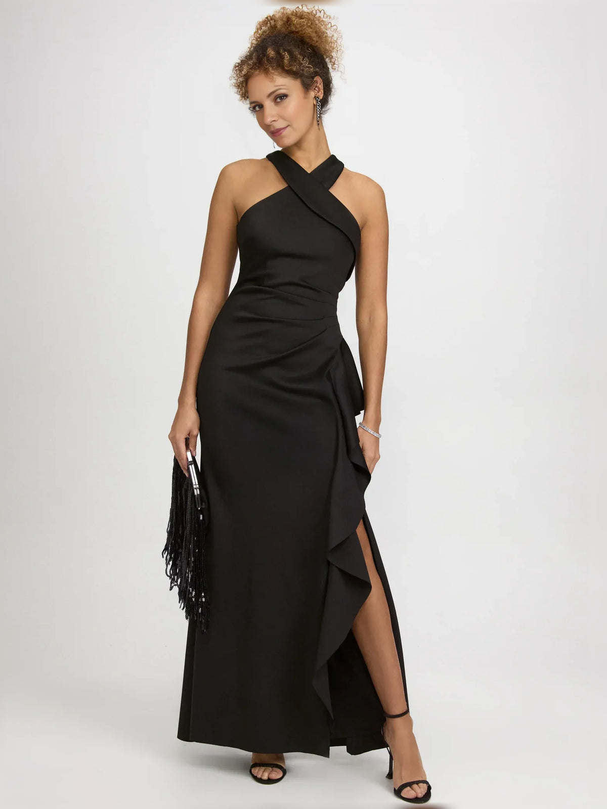 Black sheath floor-length formal dress with halter neckline, full-length front view