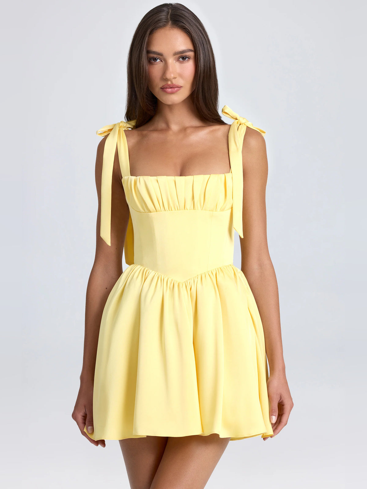 Yellow mini homecoming dress, front view showing the silhouette