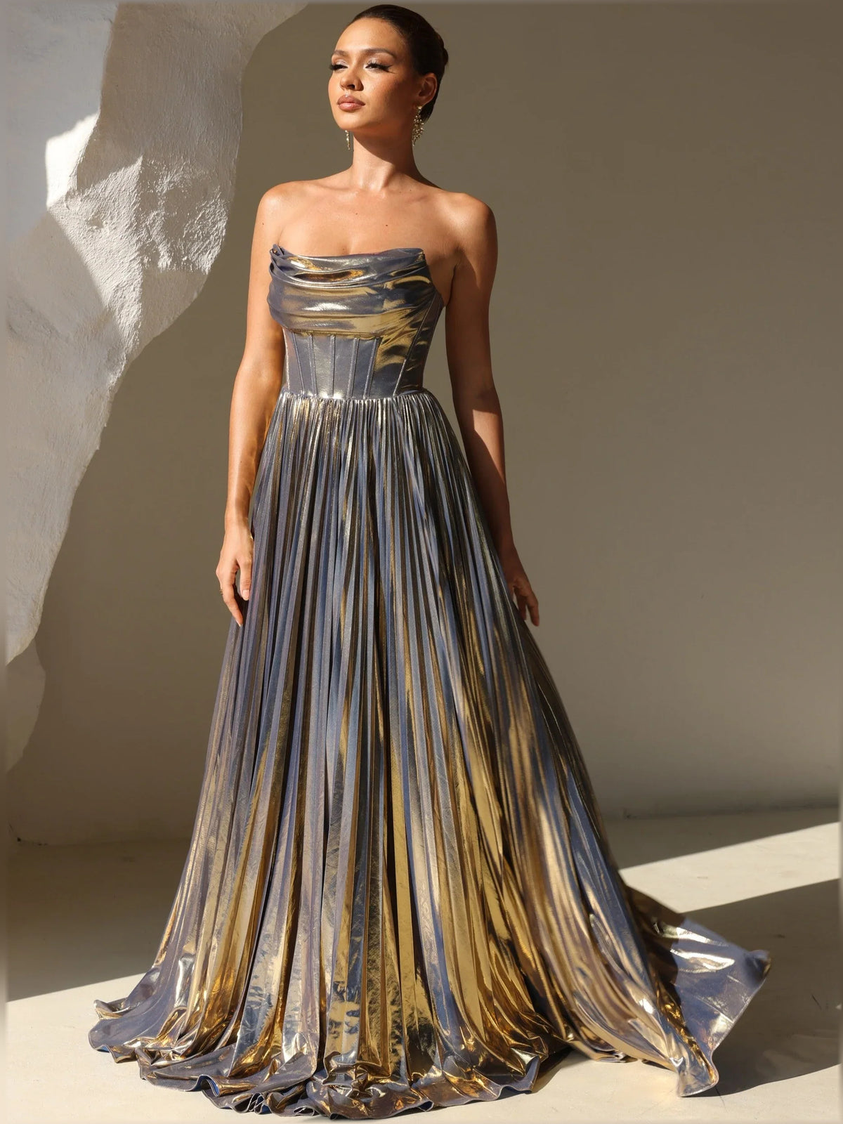 Gold a-line floor-length formal dress with strapless neckline, full-length front view