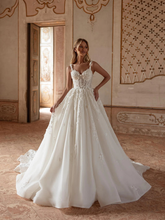 Ivory floor-length wedding dress, front view showing the ball-gown silhouette