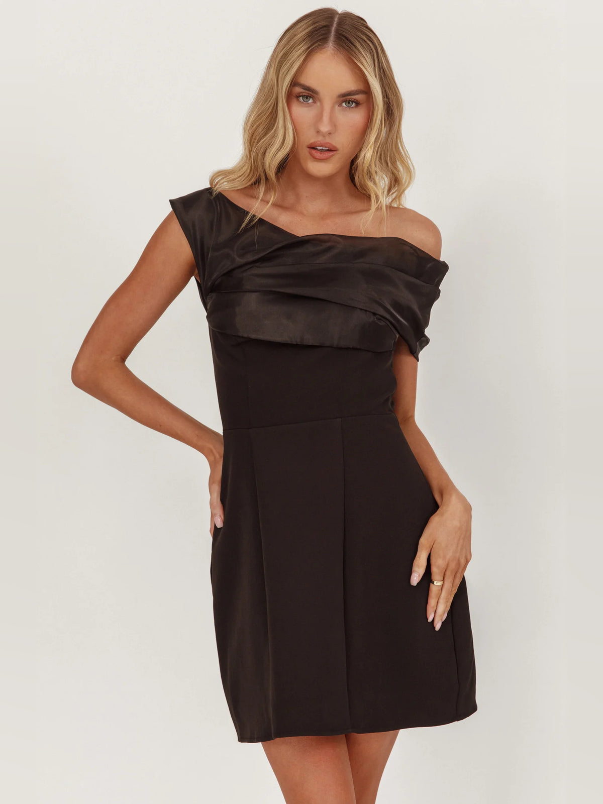 Black mini homecoming dress, front view showing the a-line silhouette