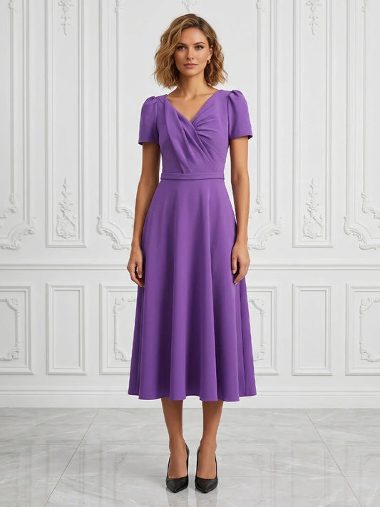 Purple midi mother of the bride dress, front view showing the a-line silhouette