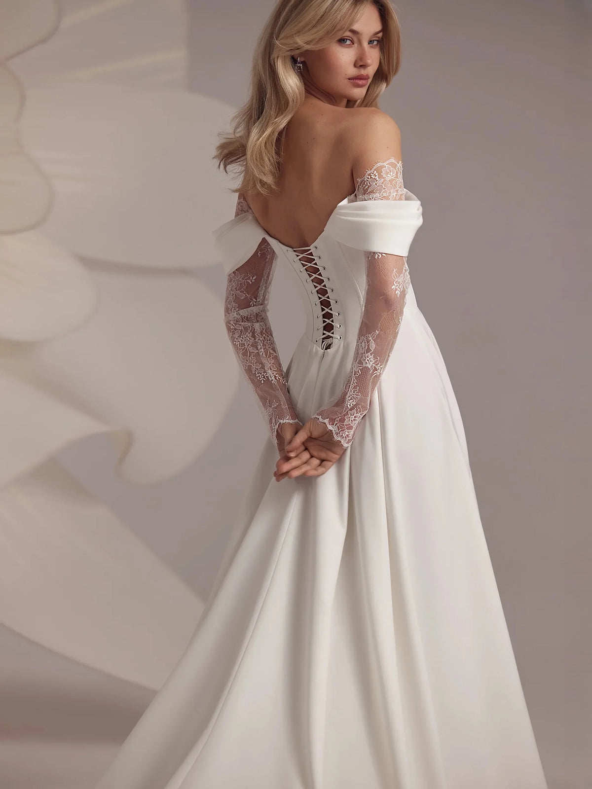 Ivory floor-length wedding dress, front view showing the a-line silhouette