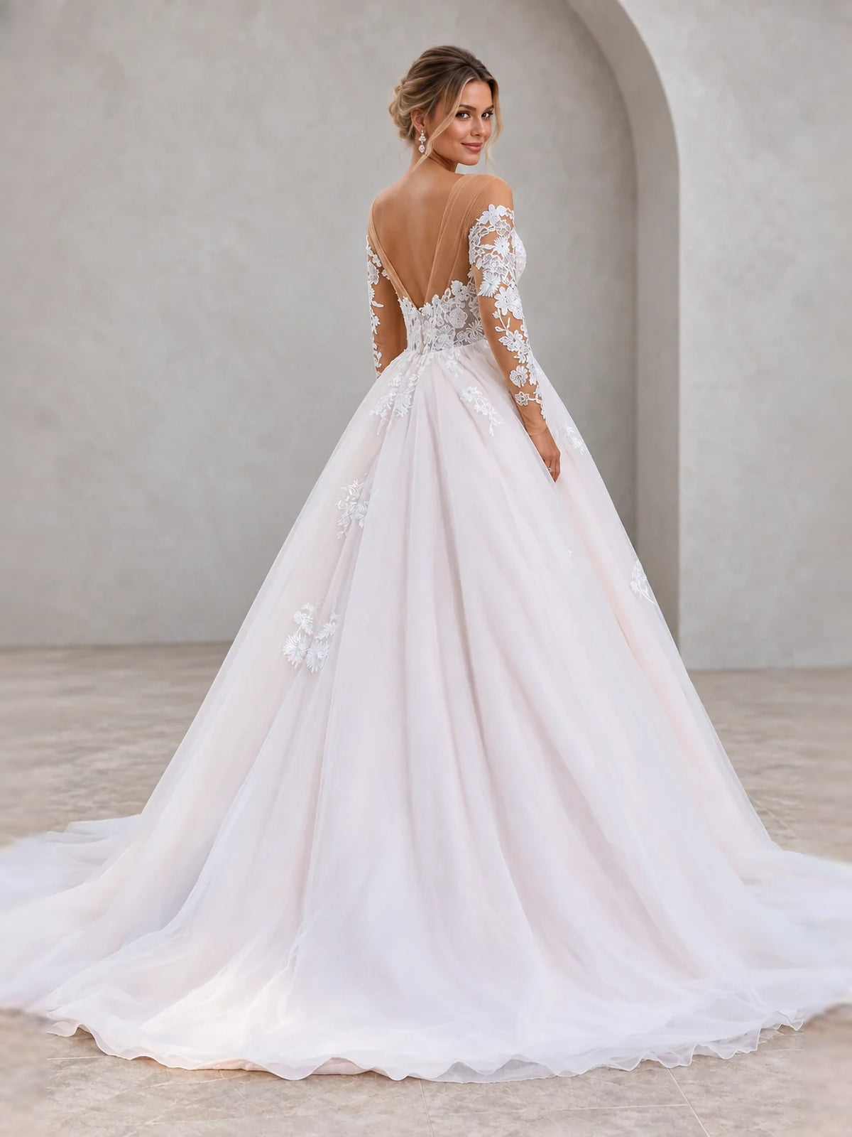 Ivory floor-length wedding dress, front view showing the a-line silhouette
